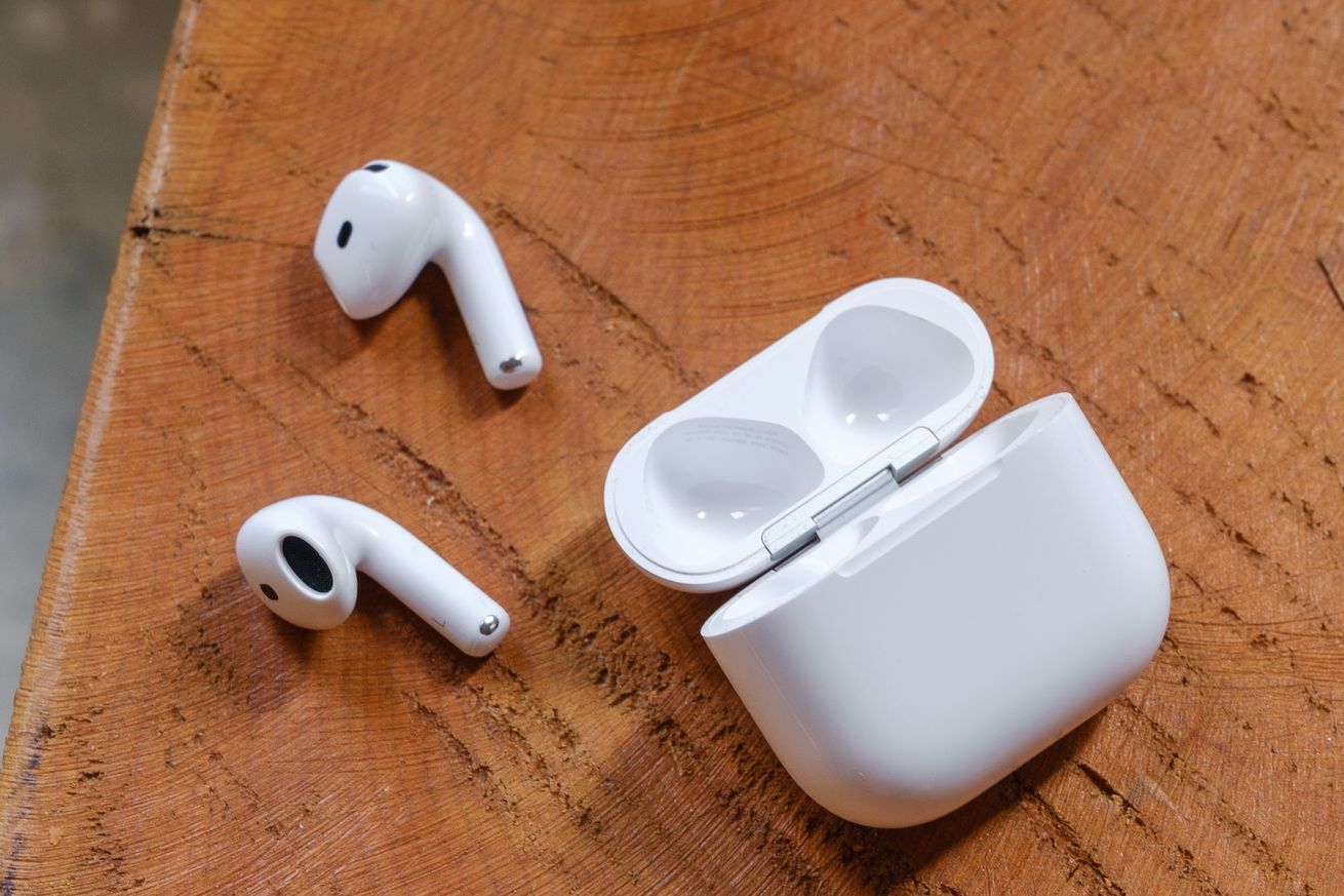 A hands-on photo of Apple’s AirPods 4 wireless earbuds.